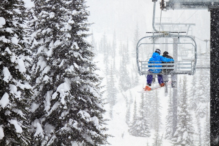 A couple on a chairlift at Whitefish Mountain Resort